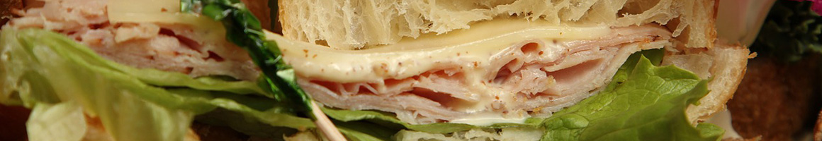 Eating Sandwich at Atlanta Bread Wilmington restaurant in Wilmington, NC.